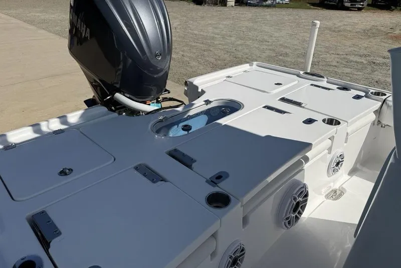Slide: The Image of 2026 Tidewater 2500 Carolina Bay boat with Yamaha engine, featuring spacious deck and storage compartments. - 32