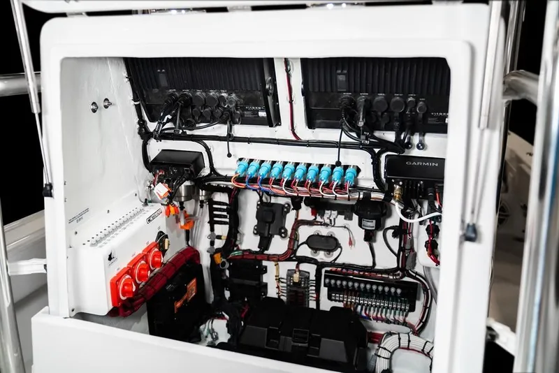 Slide: The Image of Electrical system of 2026 Contender 26 Bay boat, featuring organized wiring and Garmin equipment. - 17