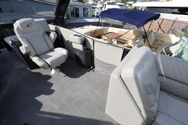 Slide: The Image of 2022 Crest Caribbean Platinum 250SLRC boat interior with luxurious seating and modern design. - 13