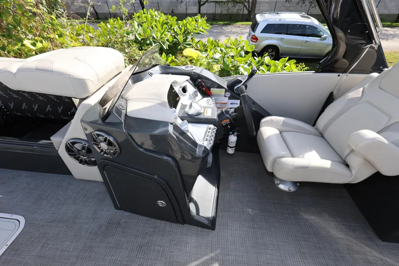 Slide: The Image of 2022 Crest Caribbean Platinum 250SLRC boat interior with modern helm and seating. - 14