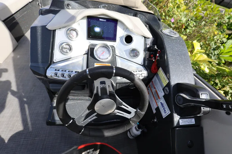 Slide: The Image of Steering console of 2022 Crest Caribbean Platinum 250SLRC boat with control panel and gauges. - 15