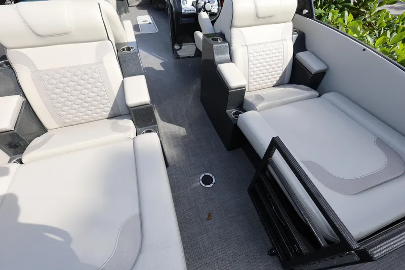 Slide: The Image of 2022 Crest Caribbean Platinum 250SLRC boat interior with luxurious seating and cup holders. - 7