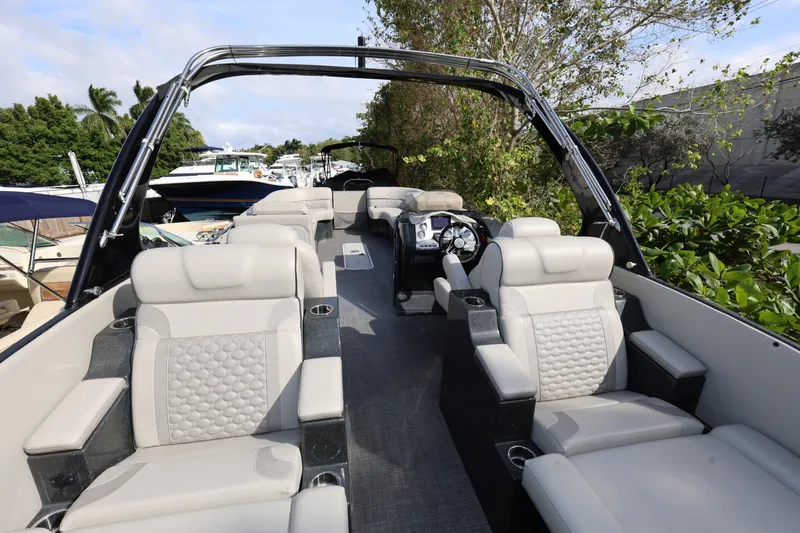 Slide: The Image of 2022 Crest Caribbean Platinum 250SLRC pontoon boat with luxurious seating and sleek design. - 8