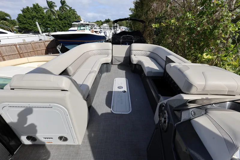 Slide: The Image of 2022 Crest Caribbean Platinum 250SLRC pontoon boat with spacious seating and modern design. - 9