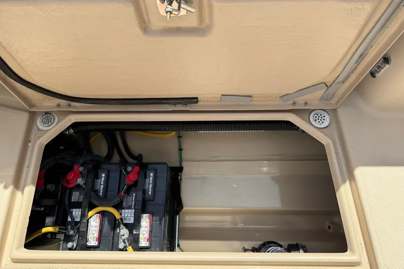 Slide: The Image of 2017 Ranger Tugs R-23 boat battery compartment with wiring and components. - 12