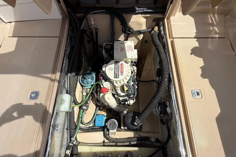 Slide: The Image of Engine compartment of a 2017 Ranger Tugs R-23 boat, showcasing mechanical components. - 14
