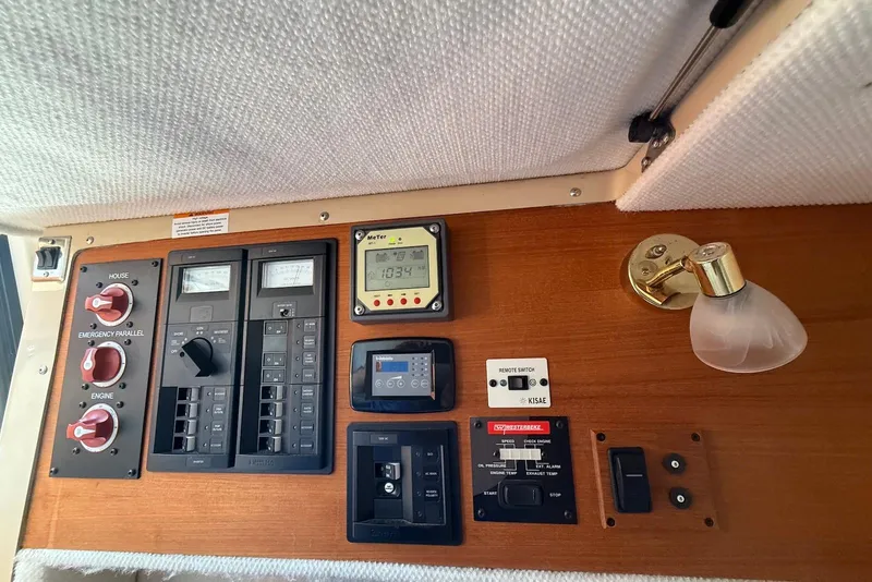 Slide: The Image of Control panel of a 2017 Ranger Tugs R-23 boat with switches and gauges. - 19