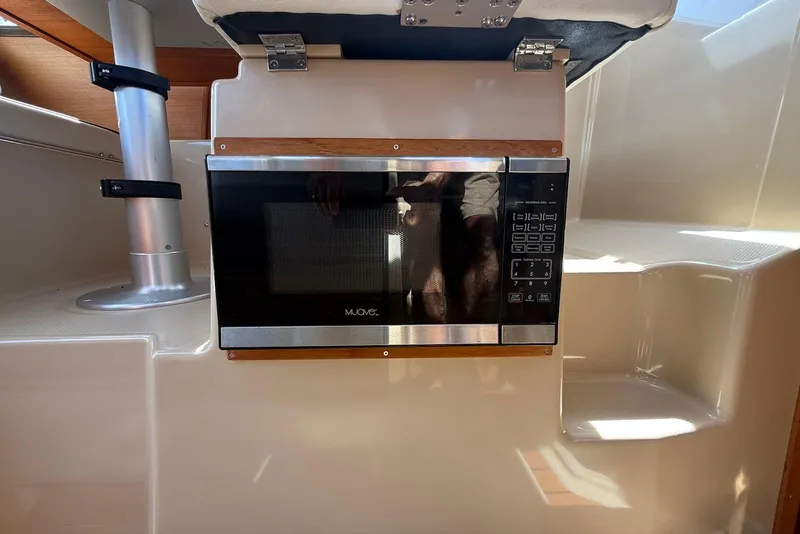 Slide: The Image of Microwave installed in 2017 Ranger Tugs R-23 boat interior. - 21