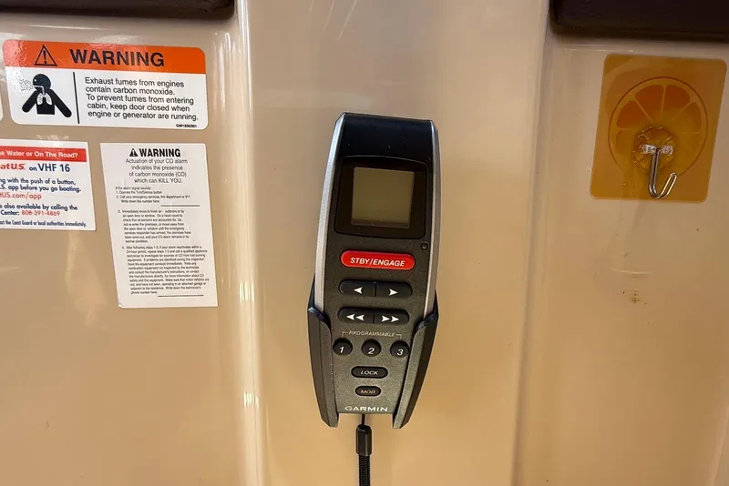 Slide: The Image of Garmin marine device on 2017 Ranger Tugs R-23 with warning labels. - 23