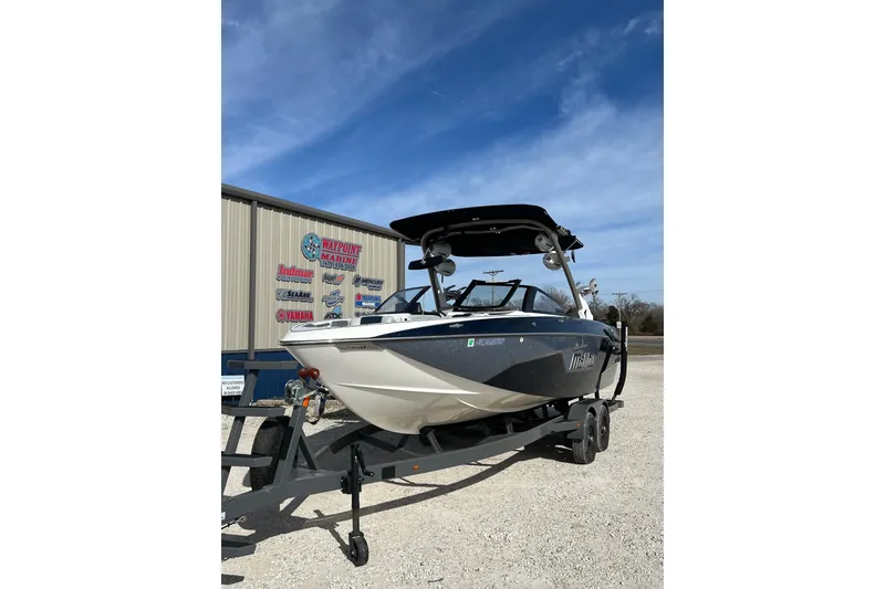Slide: The Image of 2021 Malibu Wakesetter 25 LSV boat on trailer at Waypoint Marine. - 2