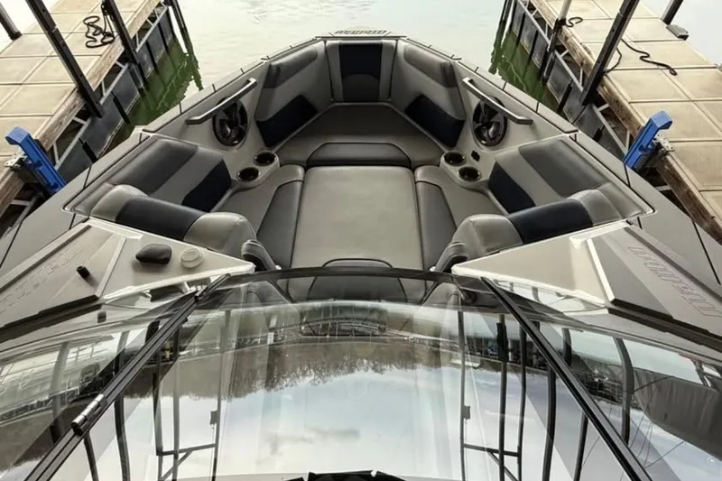 Slide: The Image of 2021 Malibu Wakesetter 25 LSV boat interior with spacious seating and sleek design. - 28