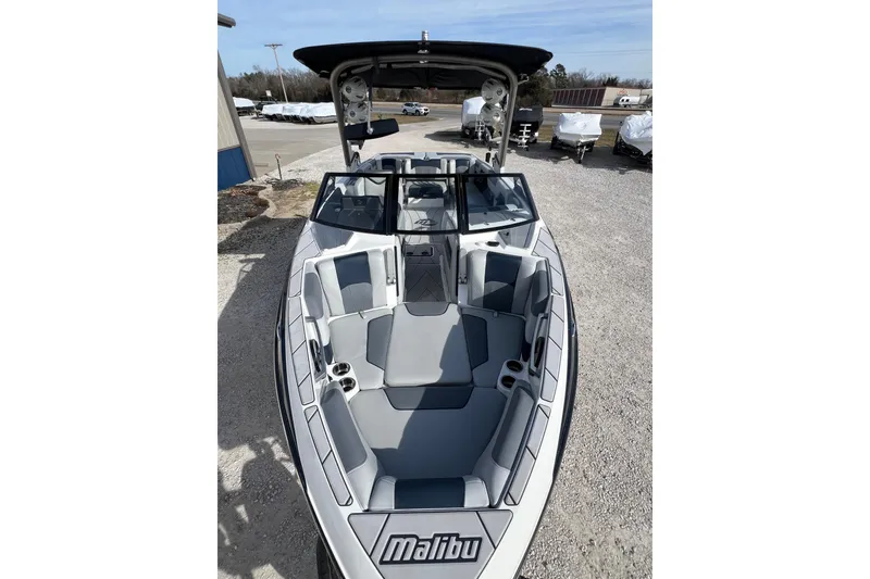 Slide: The Image of 2021 Malibu Wakesetter 25 LSV boat with spacious seating and sleek design. - 6