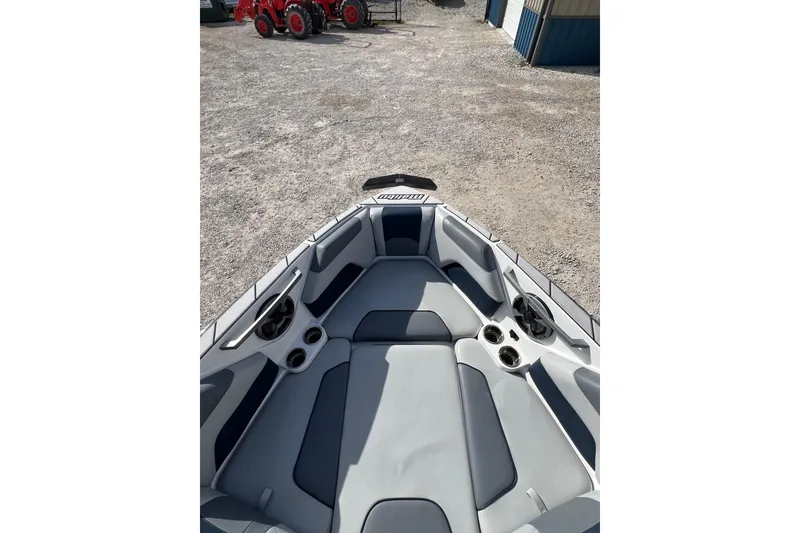 Slide: The Image of 2021 Malibu Wakesetter 25 LSV boat interior with gray seating and cup holders. - 7