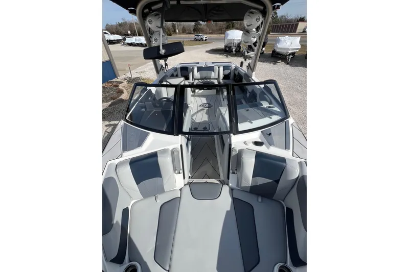 Slide: The Image of 2021 Malibu Wakesetter 25 LSV boat interior with sleek seating and modern design. - 8