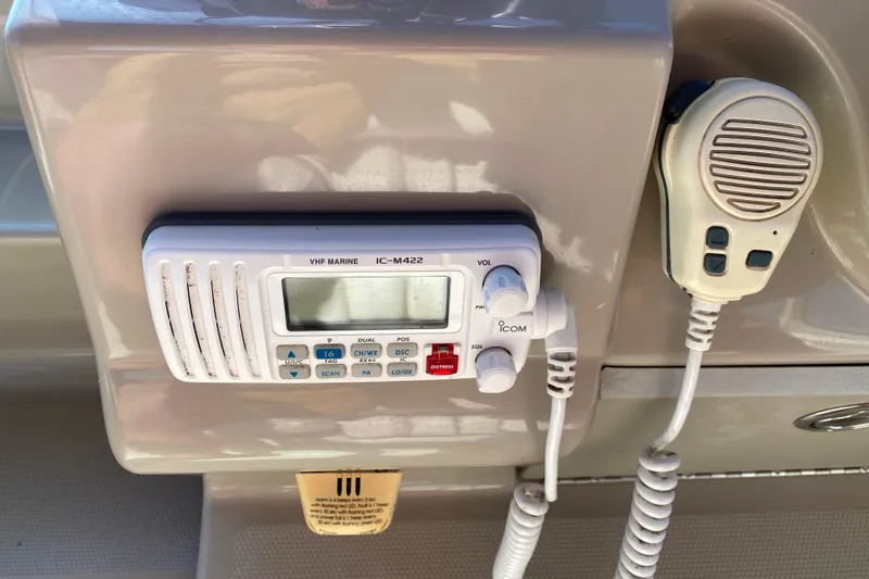 Slide: The Image of VHF marine radio on 2006 Sea Ray 240 Sundancer boat dashboard. - 7