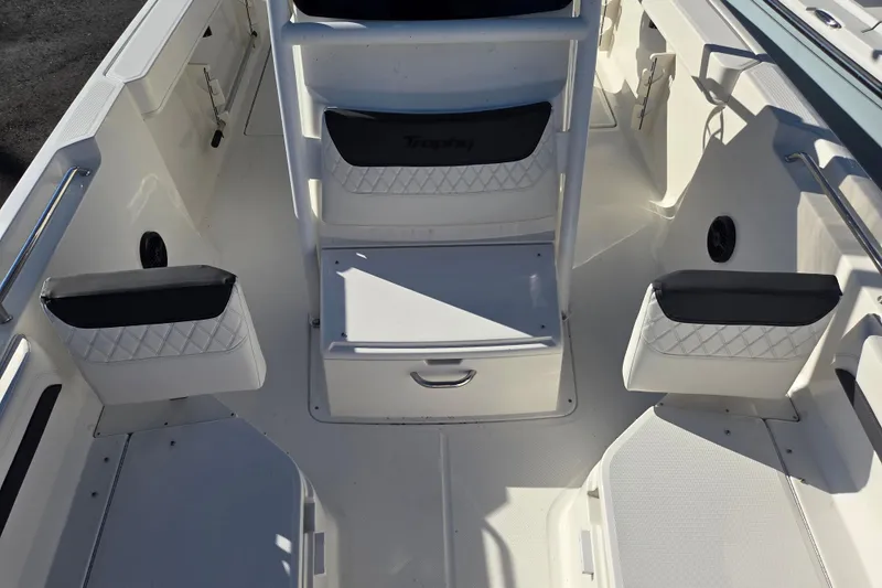 Slide: The Image of 2023 Trophy T24 CC boat interior with seating and storage compartments. - 13