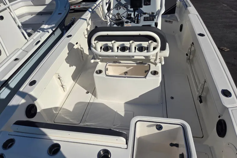 Slide: The Image of 2023 Trophy T24 CC boat interior with seating and control panel. - 8