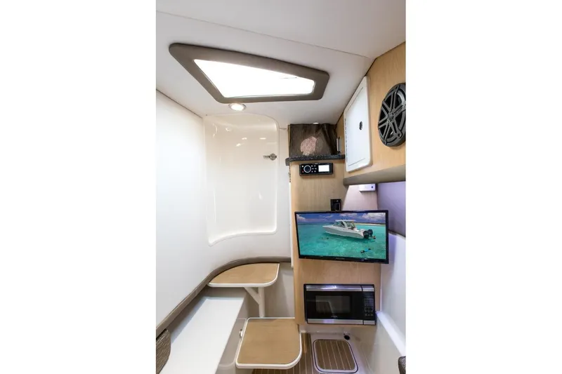 Slide: The Image of Interior of 2026 World Cat 325DC boat with modern amenities and sleek design. - 17