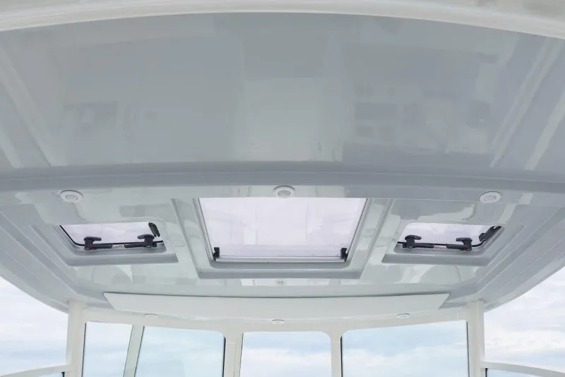 Slide: The Image of 2026 World Cat 325DC boat roof with skylights and sleek design. - 22