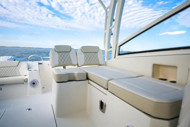 Slide: The Image of Luxurious seating on 2026 World Cat 325DC boat with ocean view and blue sky. - 7