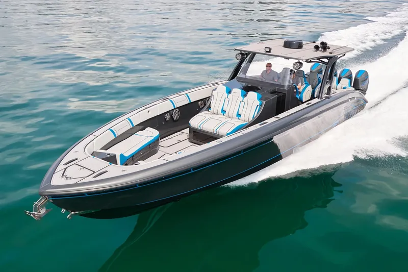 Slide: The Image of 2020 Midnight Express 43' Open boat cruising on clear blue water. - 1