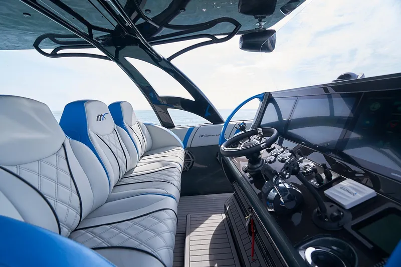 Slide: The Image of Interior of 2020 Midnight Express 43' Open boat with modern helm and luxurious seating. - 13