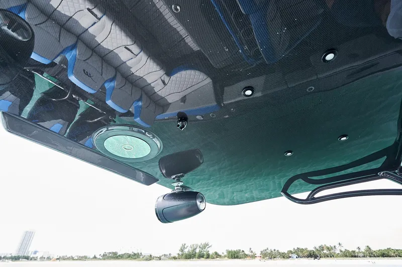 Slide: The Image of 2020 Midnight Express 43' Open boat, underside view with speakers and seating reflections. - 17