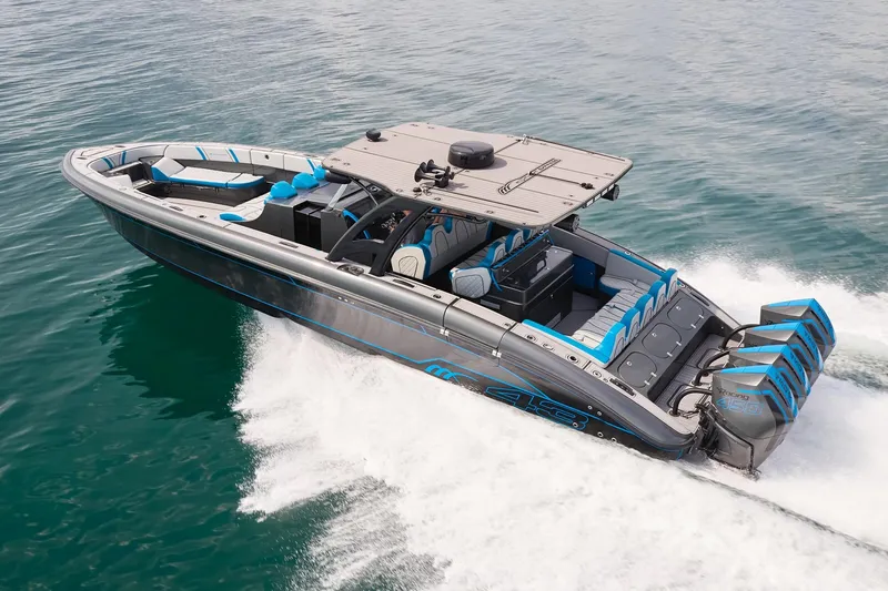 Slide: The Image of 2020 Midnight Express 43' Open boat cruising on water with powerful engines. - 2