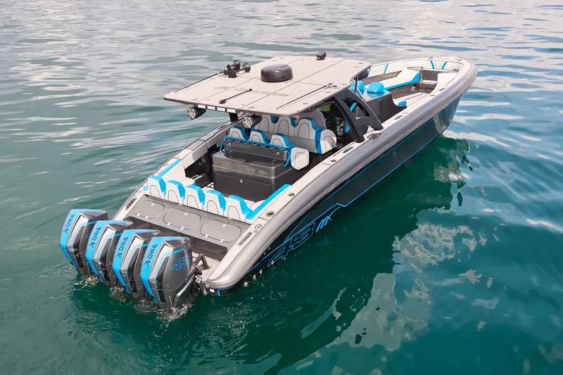 Slide: The Image of 2020 Midnight Express 43' Open boat with quad engines on clear water. - 6
