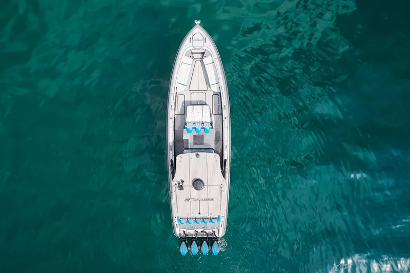 Slide: The Image of Aerial view of 2020 Midnight Express 43' Open boat on clear blue water. - 7