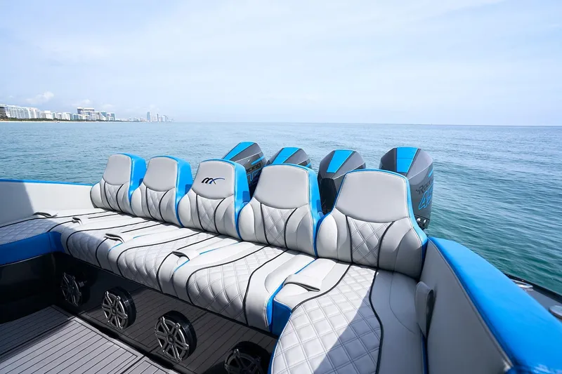 Slide: The Image of 2020 Midnight Express 43' Open boat with luxurious seating and powerful engines on open water. - 8