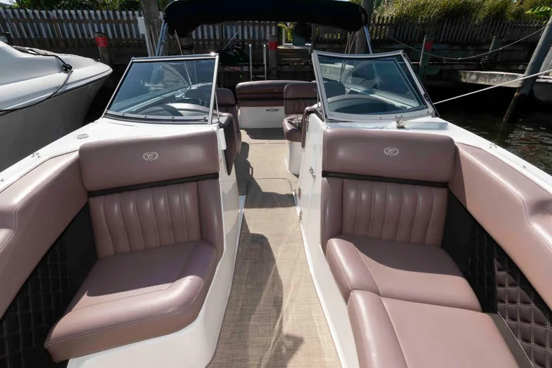 Slide: The Image of 2013 Cobalt A28 boat interior with luxurious seating and sleek design. - 11
