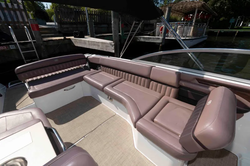 Slide: The Image of 2013 Cobalt A28 boat interior with luxurious seating and sleek design. - 13