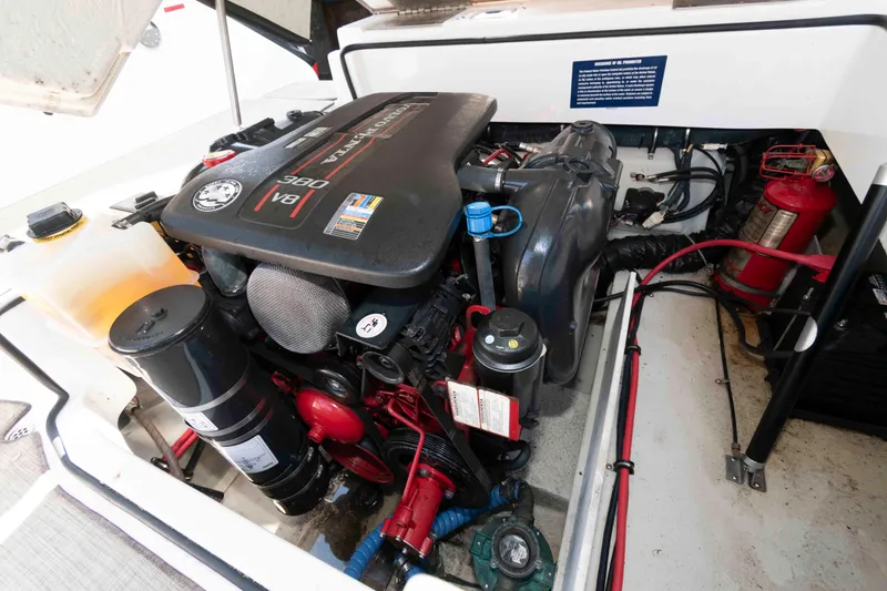 Slide: The Image of Engine compartment of a 2013 Cobalt A28 boat, featuring a V8 engine. - 16