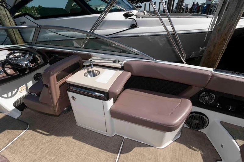 Slide: The Image of 2013 Cobalt A28 boat interior with seating and sink, featuring luxurious design elements. - 8