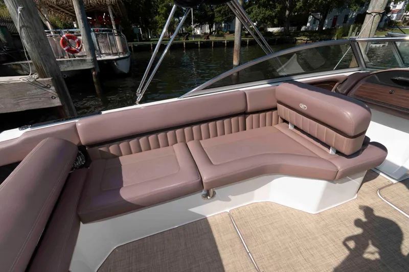 Slide: The Image of Luxurious seating on 2013 Cobalt A28 boat, featuring elegant brown upholstery. - 9