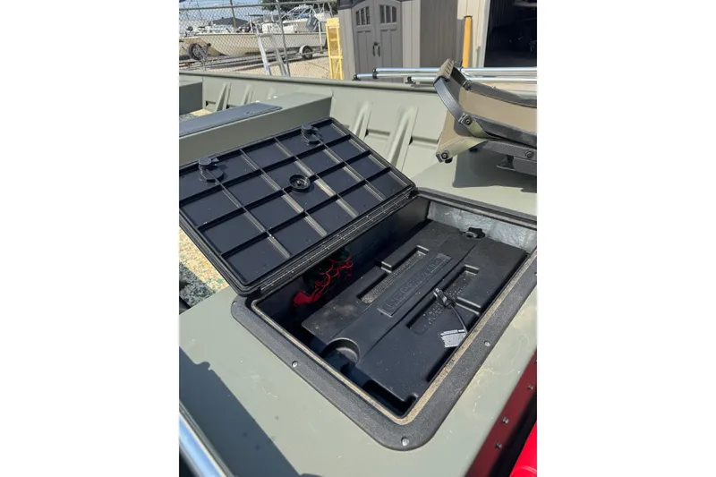 Slide: The Image of Open storage compartment on 2021 Weldcraft 15 boat, showcasing interior details. - 17