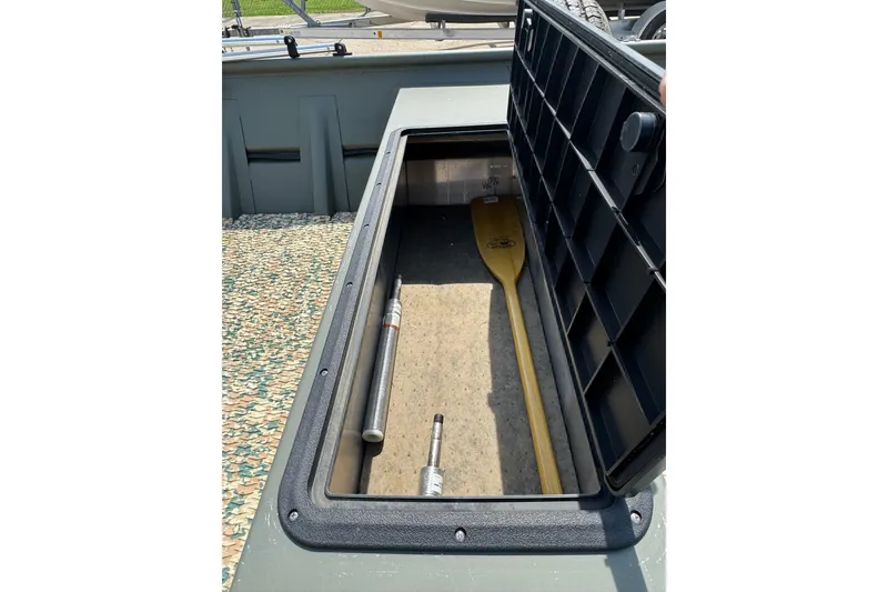 Slide: The Image of Open storage compartment in 2021 Weldcraft 15 boat with paddle and equipment. - 20