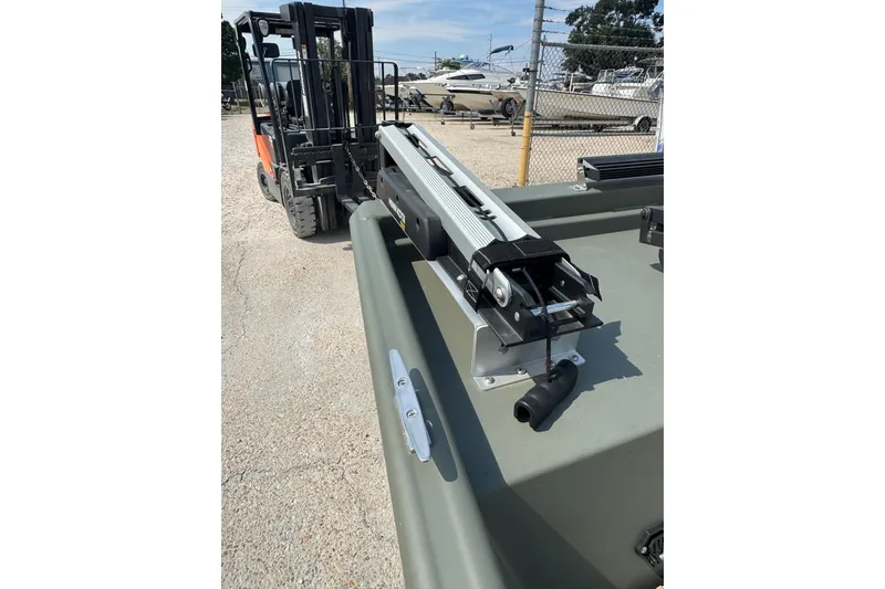 Slide: The Image of 2021 Weldcraft 15 boat with forklift, docked in a marina setting. - 25