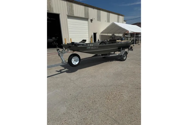 Slide: The Image of 2021 Weldcraft 15 boat on trailer outside industrial building. - 7