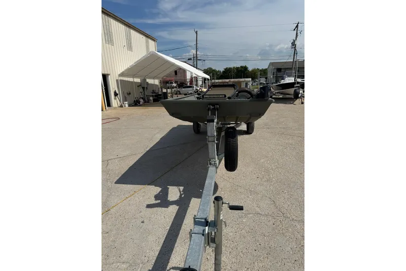 Slide: The Image of 2021 Weldcraft 15 boat on trailer in outdoor storage area. - 8