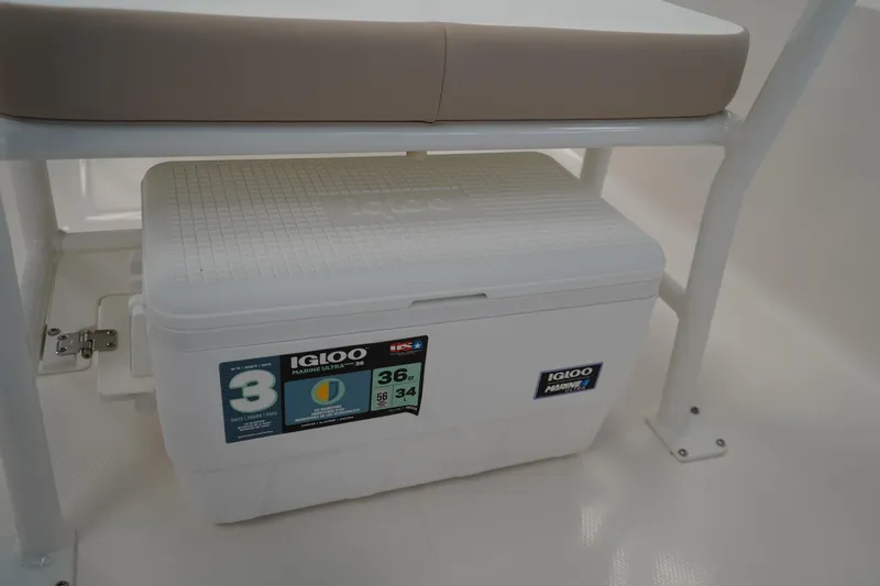 Slide: The Image of 2026 Robalo R160 Center Console with Igloo Marine Ultra cooler under seat. - 11