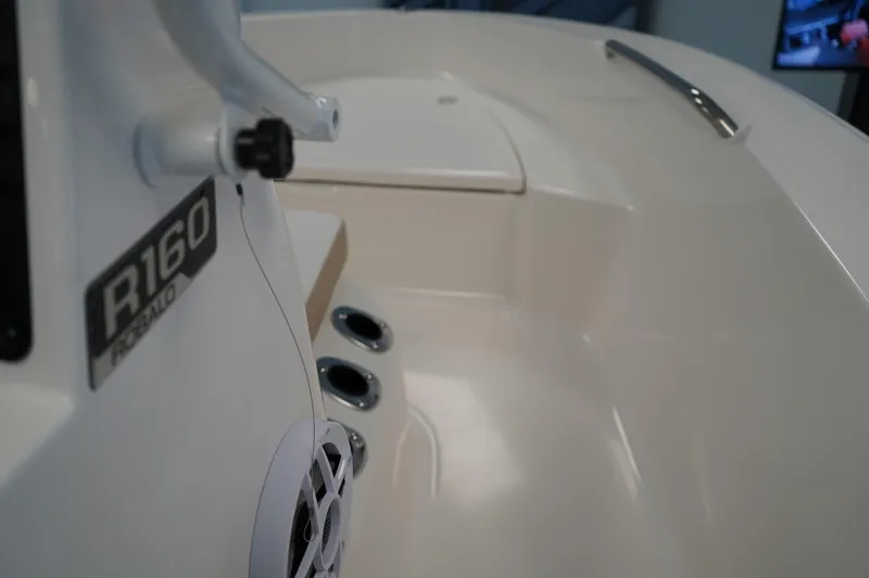Slide: The Image of 2026 Robalo R160 Center Console boat interior with speaker and control panel. - 14