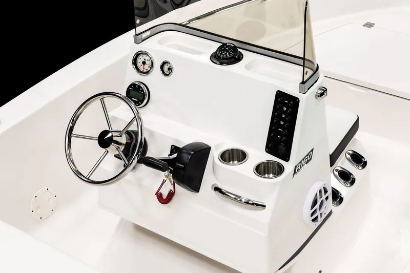 Slide: The Image of 2026 Robalo R160 Center Console boat with Yamaha engine in showroom. - 6