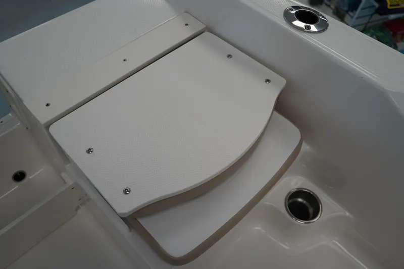 Slide: The Image of 2026 Robalo R160 Center Console boat seat detail with stainless steel fixtures. - 9