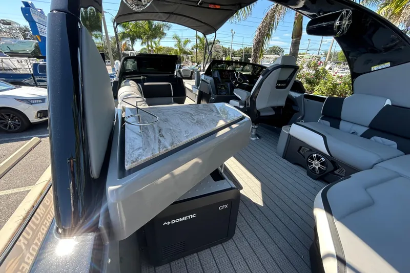 Slide: The Image of Interior of 2026 Avalon Excalibur 27-Foot boat with luxurious seating and modern amenities. - 16
