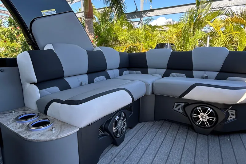 Slide: The Image of Luxurious seating on 2026 Avalon Excalibur 27-foot boat with cup holders and speakers. - 8