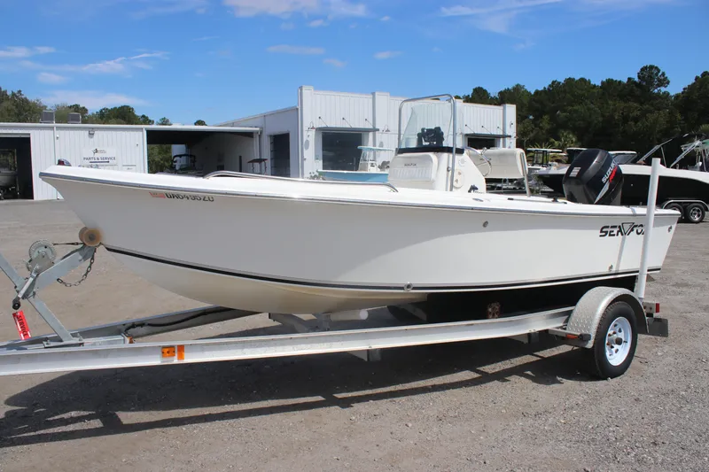 Slide: The Image of 2007 Sea Fox 172 Center Console boat on trailer, parked near service building. - 1