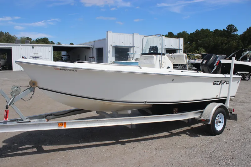 Slide: The Image of 2007 Sea Fox 172 Center Console boat on trailer, parked outside service center. - 2