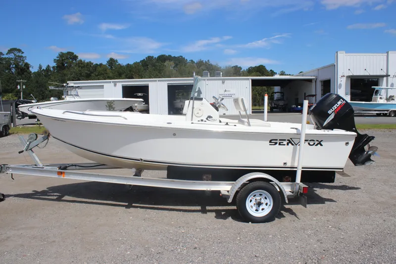 Slide: The Image of 2007 Sea Fox 172 Center Console boat on trailer, parked outdoors. - 8
